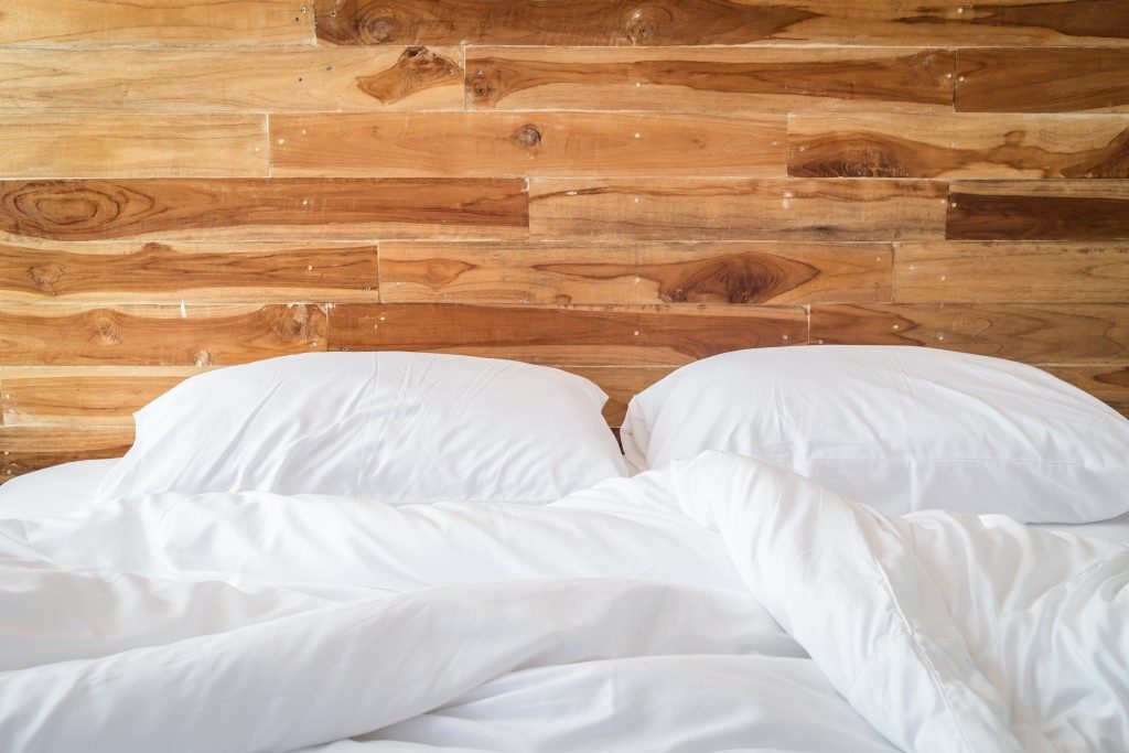 Bed with white pillows and sheets
