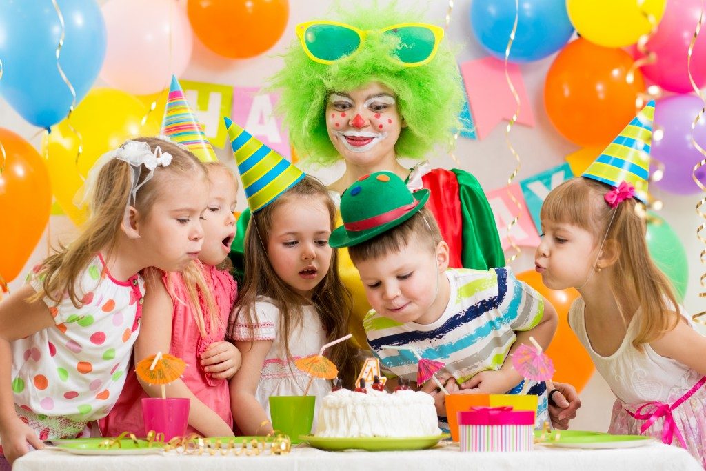 Little boy blowing a candle