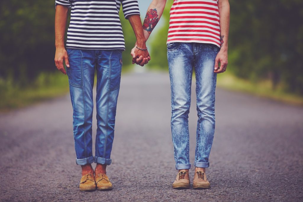 two men holding hands