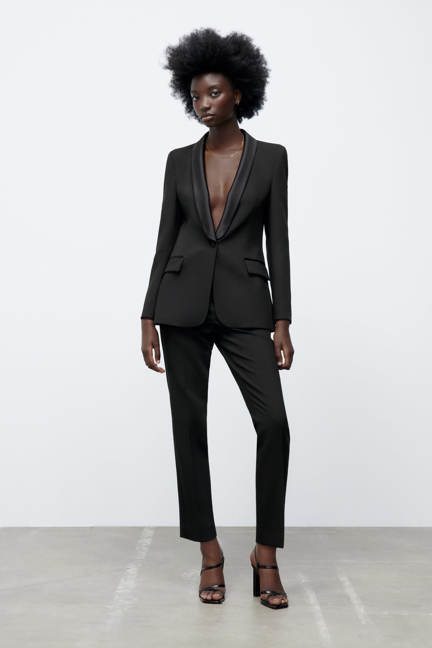 woman in tuxedo inspired black suit