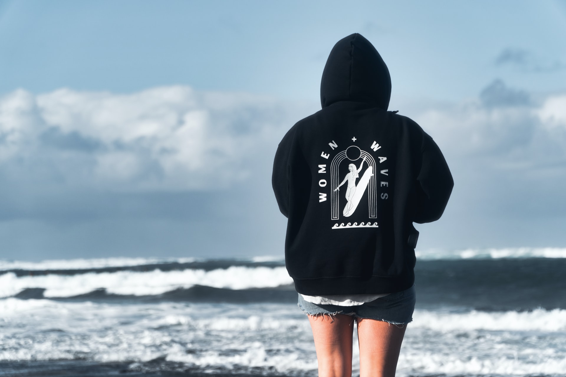 woman in black hoodie on the beach
