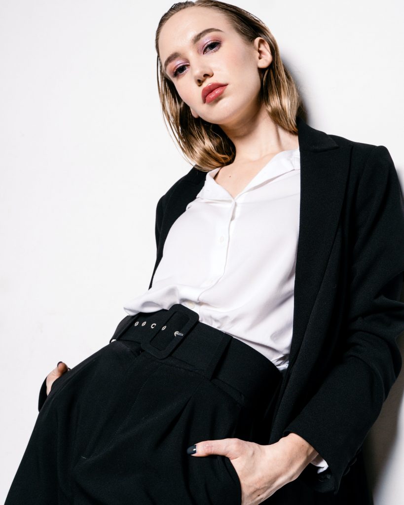woman in black suit white top